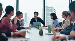 Laptop, leader and business, people in meeting, conversation and...