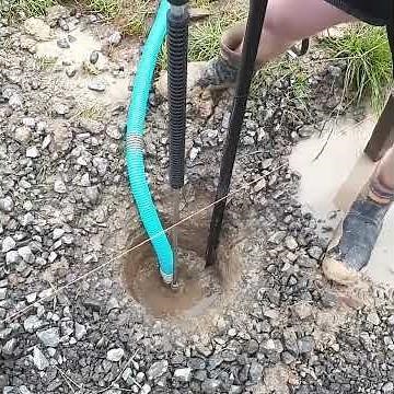 SLUDGE SUCKER DEMO. REMOVING WATER FROM POST HOLE.