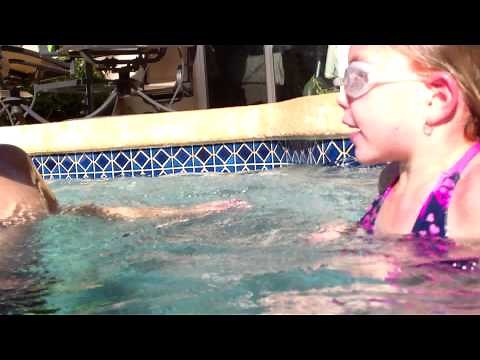 Kids hugging underwater