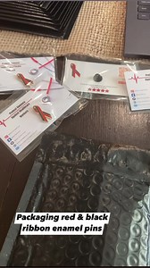26 reactions | Packaging pin orders. Red & black ribbons in protest of violence against healthcare workers. #asmr #nurse #redandblackribbons | Nurse Erica | Facebook