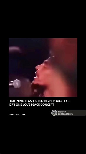 During the climax of "Jamming" at the 1978 One Love Peace Concert, a bolt of lightning famously streaked across the sky just as Bob Marley united the hands of political rivals Michael Manley and Edward Seaga. This atmospheric coincidence was viewed by many as a divine sign of approval for the symbolic gesture of peace during a period of intense civil unrest in Jamaica. Credit: Tuff Gong Pictures, Island Records, and Jimmy Lewis | History In Pictures