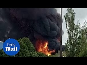 Black smoke billows out of fire in Leamington Spa as people watch