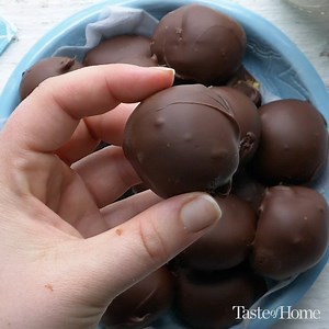 These no-bake chocolate peanut butter balls are always a hit! They resemble chestnuts or buckeyes—hence the name. Click here for the recipe: https://trib.al/LupEJcn | Taste of Home