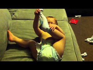 Baby Taking Off Sock
