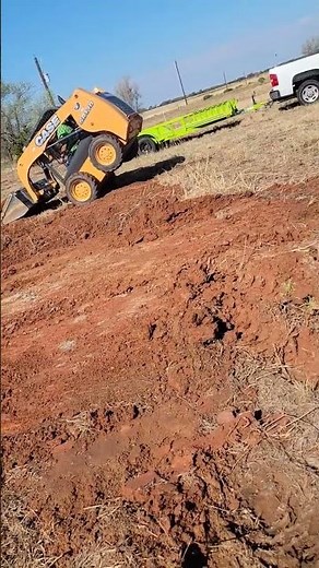 TIPPING OVER CASE SR130 SKID STEER LOADED DOWN.