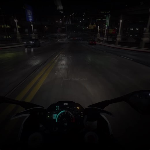 Nighttime Motorcycle Ride Through City Streets