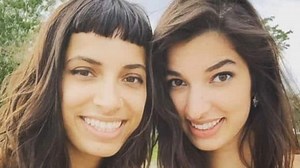 Topless sisters told to 'cover up'