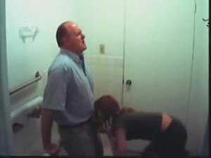Young secretary sucks off a boss's cock in the office toilet