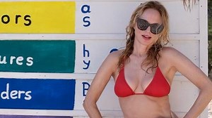 Heather Graham flaunts her toned body in bikinis on the beach