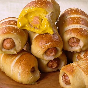 🖨️ RECIPE: https://www.theslowroasteditalian.com/2014/04/simple-homemade-pretzel-dogs-recipe.html A hot dog baked right inside a soft beer pretzel makes these the tastiest and easiest homemade pretzel dogs you will ever eat! | The Slow Roasted Italian