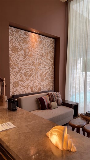 Adorning the wall of the living area, you'll discover a magnificent tapestry crafted by the skilled hands of the women from the villages of San Pablito Pahuatlán in Puebla and the nearby town of Tenango de Doria in Hidalgo. These villages share a beautiful tradition where generations of women have mastered the art of embroidery on large canvases, reflecting the nature that surrounds them, such as vibrant flowers, graceful butterflies, majestic birds, deer, and a myriad of other animals. | La Cas