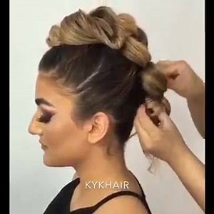 5 Ponytail, triple knotted faux Mohawk hairstyle by KYK Hair. It is easy to do...and quick too! #hotbeautymagazine #hairtutorial #fauxhawk #hairvideo | HOT Beauty Magazine