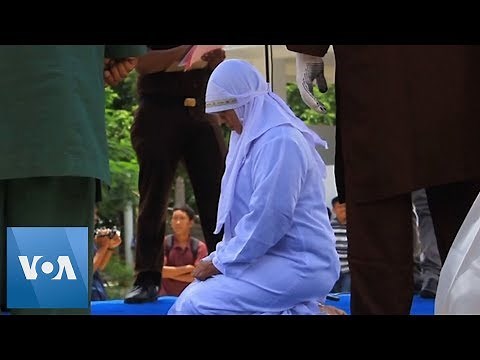 Indonesia: Woman Collapses After Being Caned for Public Affection