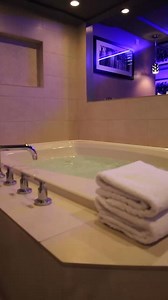 Experience the Hypnotic Suite – where energy meets elegance in a two-room suite. Engage with bed surround mirrors, indulge in the spa tub for two, and the invigorating spa shower with 3 rainheads. Feel the pulse of luxury with our electronic wall art fireplace.💲 From 128💻 https://www.verycoolrooms.com/hypnotic-ambiance-franklin-park.aspx | Ambiance Suites