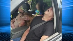 Shocking photo shows parents passed out with kid in the backseat