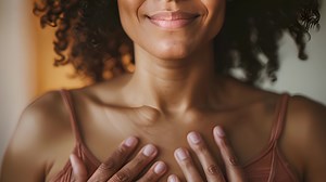 Download A woman practicing deep belly breathing to activate the vagus nerve and improve heart rate variability. for free