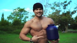 Muscular build fitness coach advertising special food stimulants...