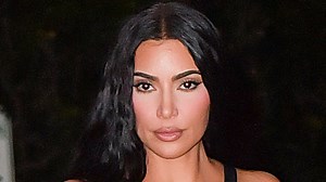 Kim Kardashian shows off her bare butt as she does cartwheels in a thong