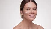 Woman doing beauty procedures on white studio background. Lady cream...