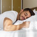 Attractive Man Sleeping in Bed