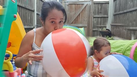 blowing up a beach ball nude