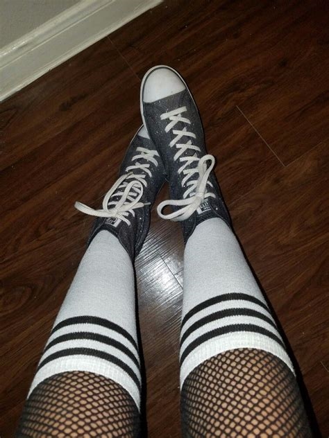 converse and fishnets nude