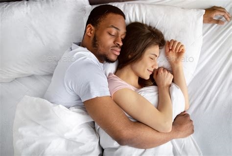 interracial couple in bed nude