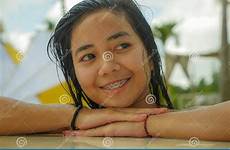 outdoors pool indonesian teenager tropical swimming smiling resort portrait asian sweet happy young beautiful girl