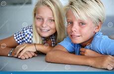 brother sister portrait teenagers blond camera looking stock photography