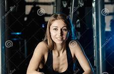 trainer helping guy female bench gym train press bar