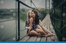 lesbian outdoors blonde concept couple together brunette bunette lesb two preview stepcousins kissing