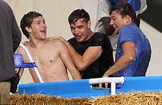 wet young direction soaking wild while live skinny dipping set guys music pool harry re people gets their brand louis
