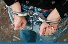 handcuffed woman back hand stock