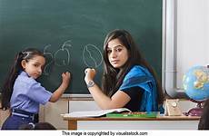 teacher indian teaching classroom student school little girl blackboard writing stock woman