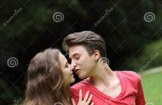 couple kissing young teenage romantic grass preview