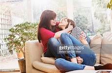 cuddling lesbian couple sofa reference poses pose livingroom article gettyimages