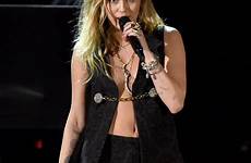 miley cyrus sexy grammys shawn mendes performance her outfit during grammy night stage last biceps popsugar wore she entertainment getty