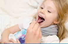 throat little girl examining tongue pediatrician