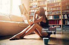 reading sexy book woman stock istock only