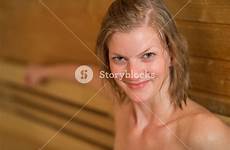 sauna sweaty woman closeup smiling stock
