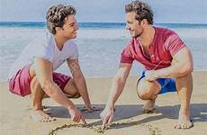 couples walking gay beach couple