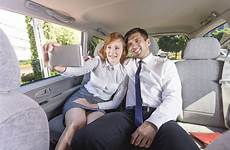 backseat taxi selfie businesspeople taking
