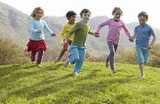 kids outside children outdoors playing play together running group adults taking freely their kindergarten without