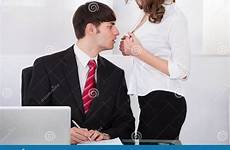 boss office seducing businesswoman young stock harassment