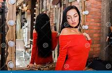 mirror brunette near woman dress fashion beautiful red care beauty preview