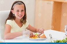 dinner girl smiling having table