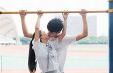 asian kissing college couple young