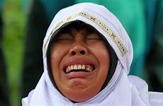 indonesia sex muslim aceh woman cries after gets her marriage caning public banda caught caned she girl proximity strokes afp