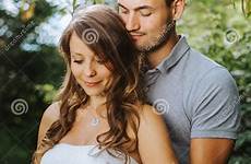 wife pregnant husband behind embracing his beautiful preview beauty baby