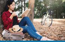 reading book tree hipster enjoying moment woman sitting under park big preview carefree activity